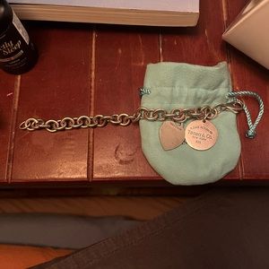 AUTHENTIC Tiffany 2 charms bracelet. 7” length. comes with original pouch.